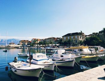 Boats moored at harbor