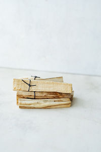 Close-up of book on table against wall