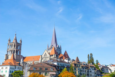 Low angle view of buildings against blue sky