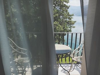 Close-up of balcony against window