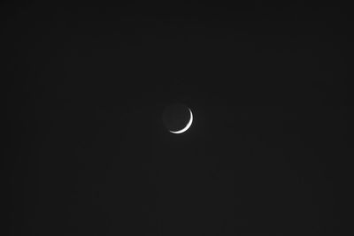 Low angle view of moon against sky at night