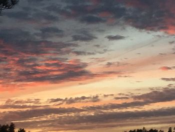 Low angle view of dramatic sky during sunset