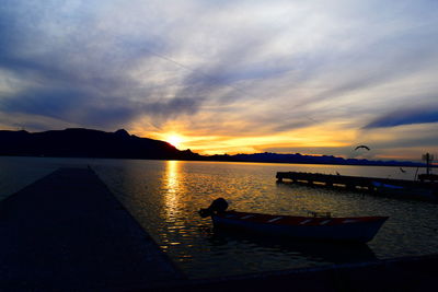 Scenic view of lake against sky during sunset