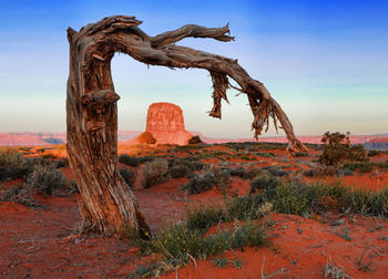 Rock formation on landscape against sky