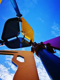 Low angle view of camera against blue sky