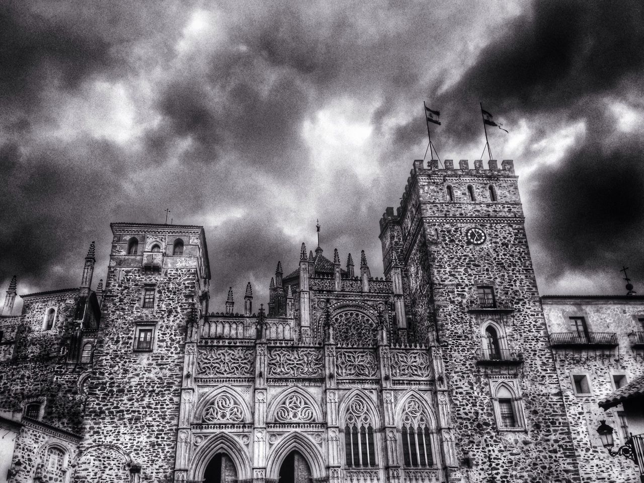 architecture, building exterior, built structure, sky, cloud - sky, cloudy, weather, storm cloud, low angle view, overcast, cloud, city, tower, building, religion, dusk, outdoors, no people, dramatic sky, residential structure