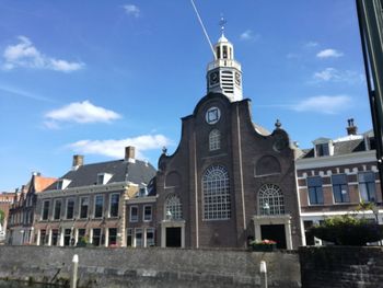 Low angle view of church against blue sky