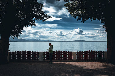 Man looking at sea against sky