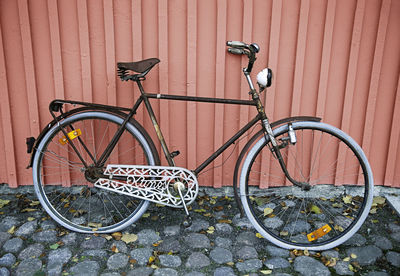 Bicycle leaning on wall