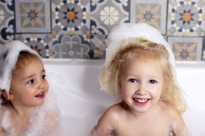 High angle view of young woman in bathtub