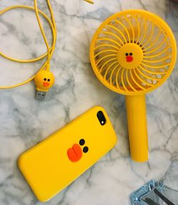 High angle view of yellow toys on table