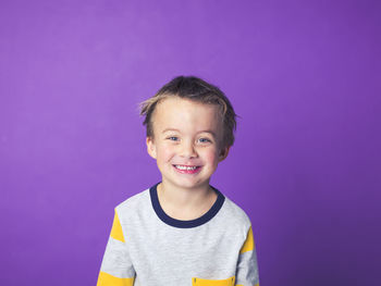 Boy against purple background