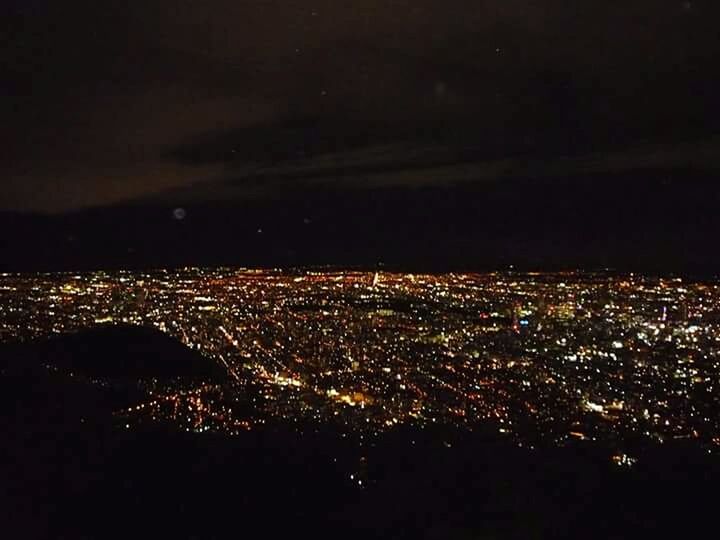 HIGH ANGLE VIEW OF ILLUMINATED CITYSCAPE