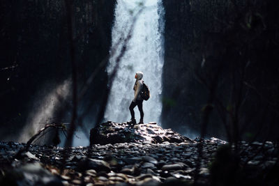 Woman standing on rocks