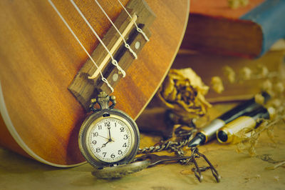 Close-up of clock on table