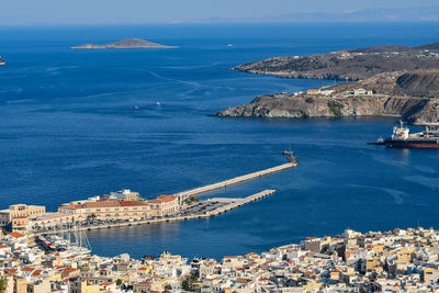 High angle view of sea and cityscape against sky