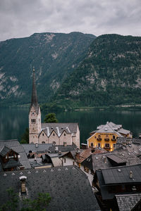 High angle view of houses by mountain in town