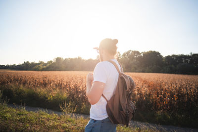 Man standing on land against clear sky