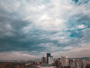 Modern buildings in city against sky