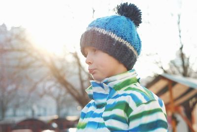 Close-up of cute boy in snow