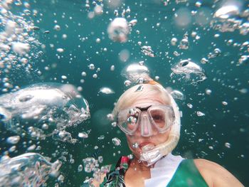 Woman swimming in sea