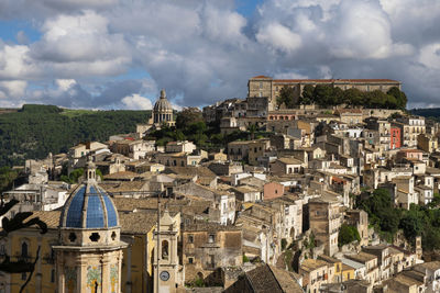 Aerial view of townscape against sky