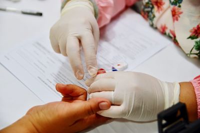 Cropped hands doing blood test of patient