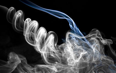 Close-up of smoke against black background