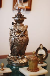 Close-up of owl on table