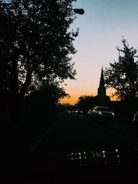 Silhouette of trees against sky at sunset