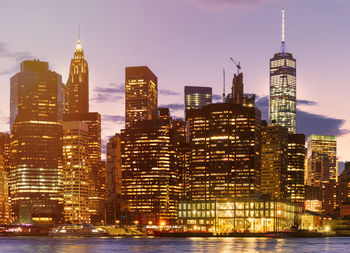 Illuminated buildings in city at night