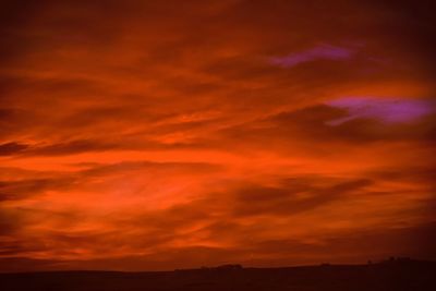 Low angle view of dramatic sky at sunset