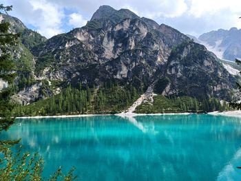 Scenic view of lake and mountains against sky, braies lake, dolomites unesco heritage