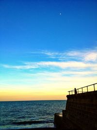 Scenic view of sea against sky at sunset