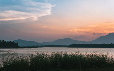 Scenic view of lake against sky during sunset