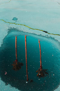 High angle view of reflection in puddle