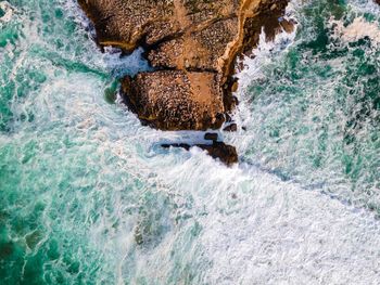 High angle view of rocks in sea