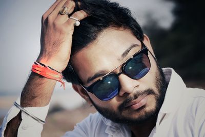 Portrait of young man wearing sunglasses