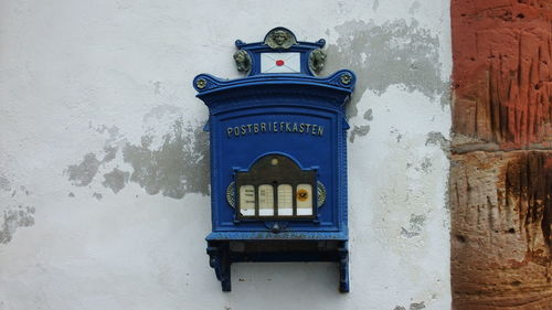 Close-up of mailbox on building wall