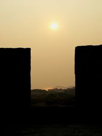 View of built structures at sunset