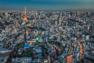 Aerial view of illuminated buildings in city