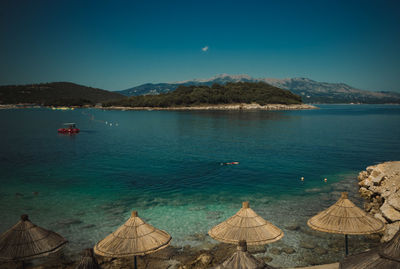 Scenic view of sea against clear blue sky