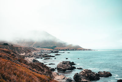 The big sur blue waters with a foggy sky.