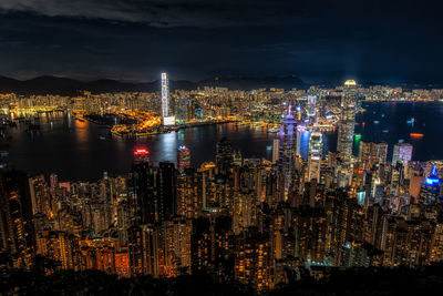 High angle view of illuminated buildings in city at night