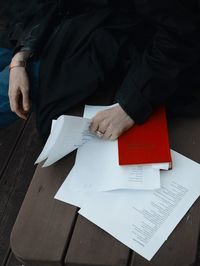 High angle view of man sitting on table