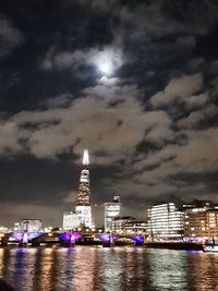 Illuminated city at waterfront