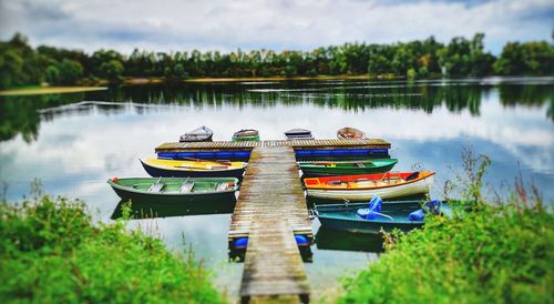 Boats in lake against sky