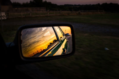 Reflection of car on side-view mirror
