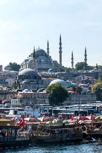 River by blue mosque against sky