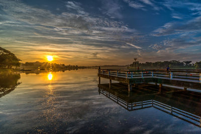 Scenic view of swimming pool against sky during sunset